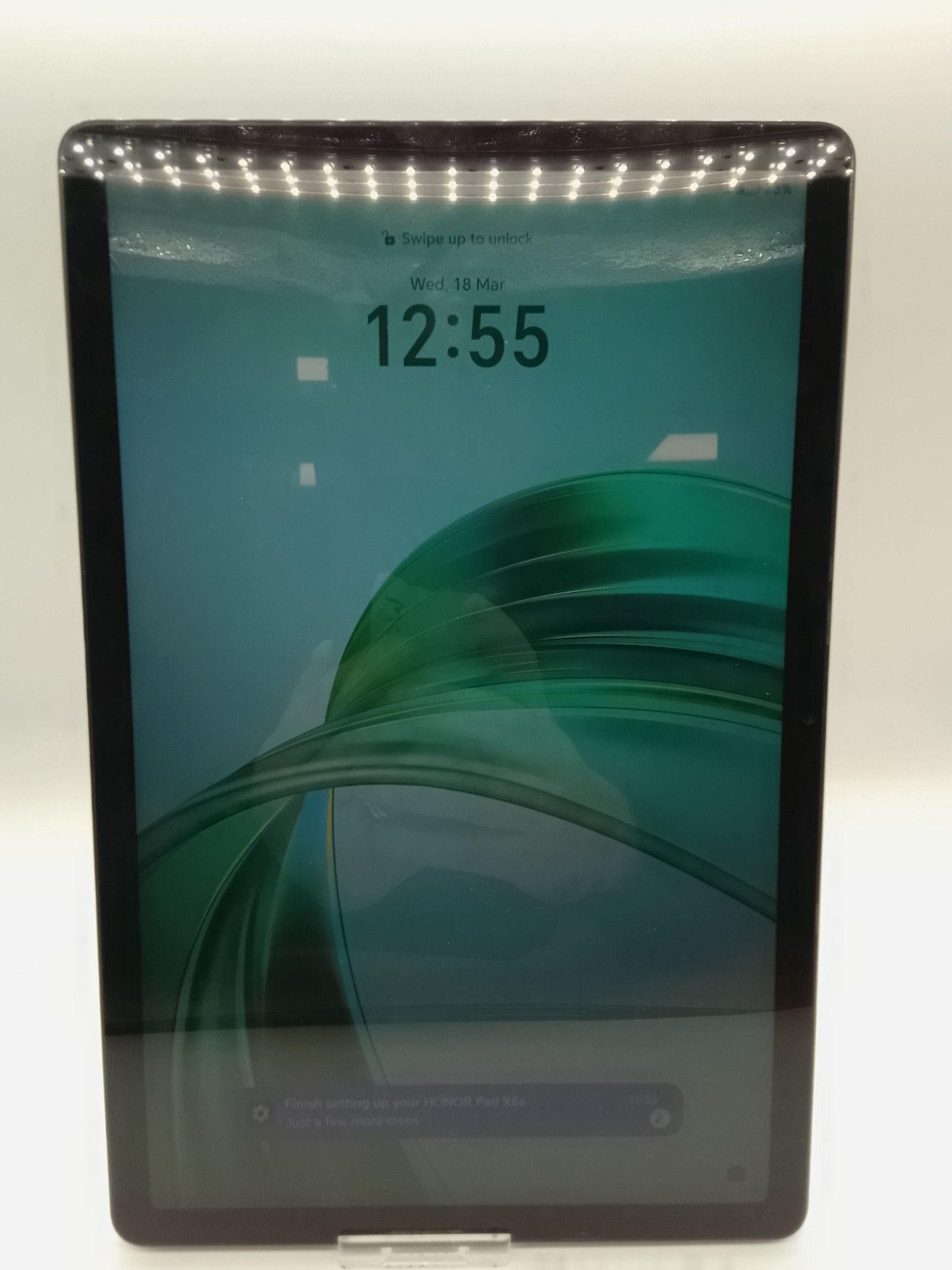 Tablet with 12:55 Display and Front LED Lights