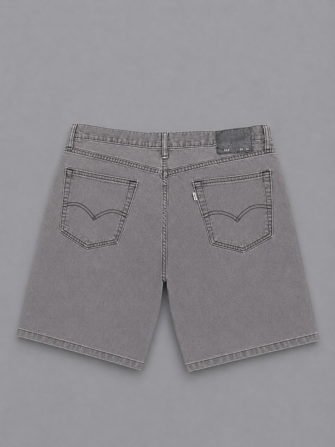 Grey Levi's 514 jeans feature a classic short 34"