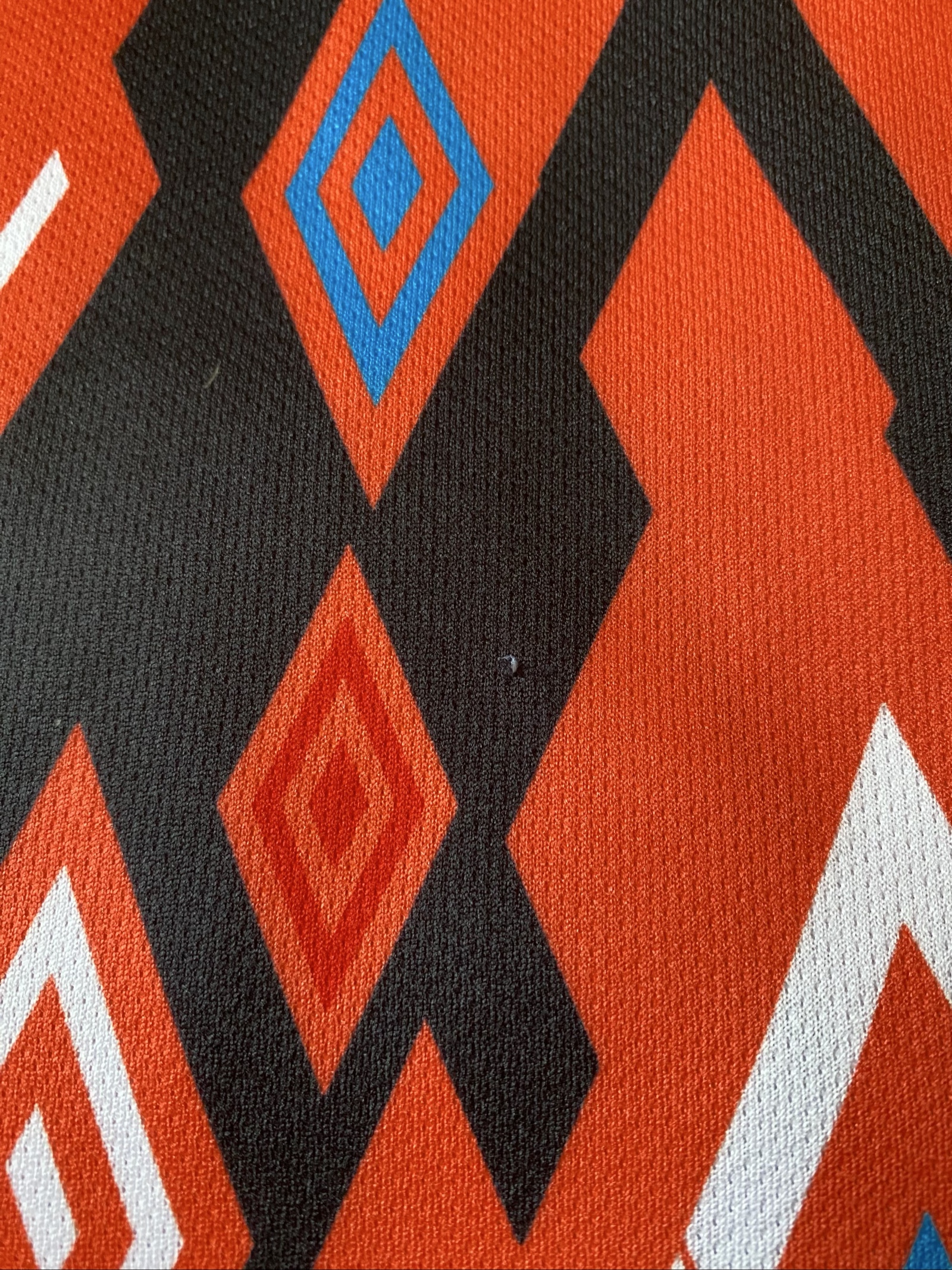 Geometric Pattern Black, Orange, Blue & White Fabric