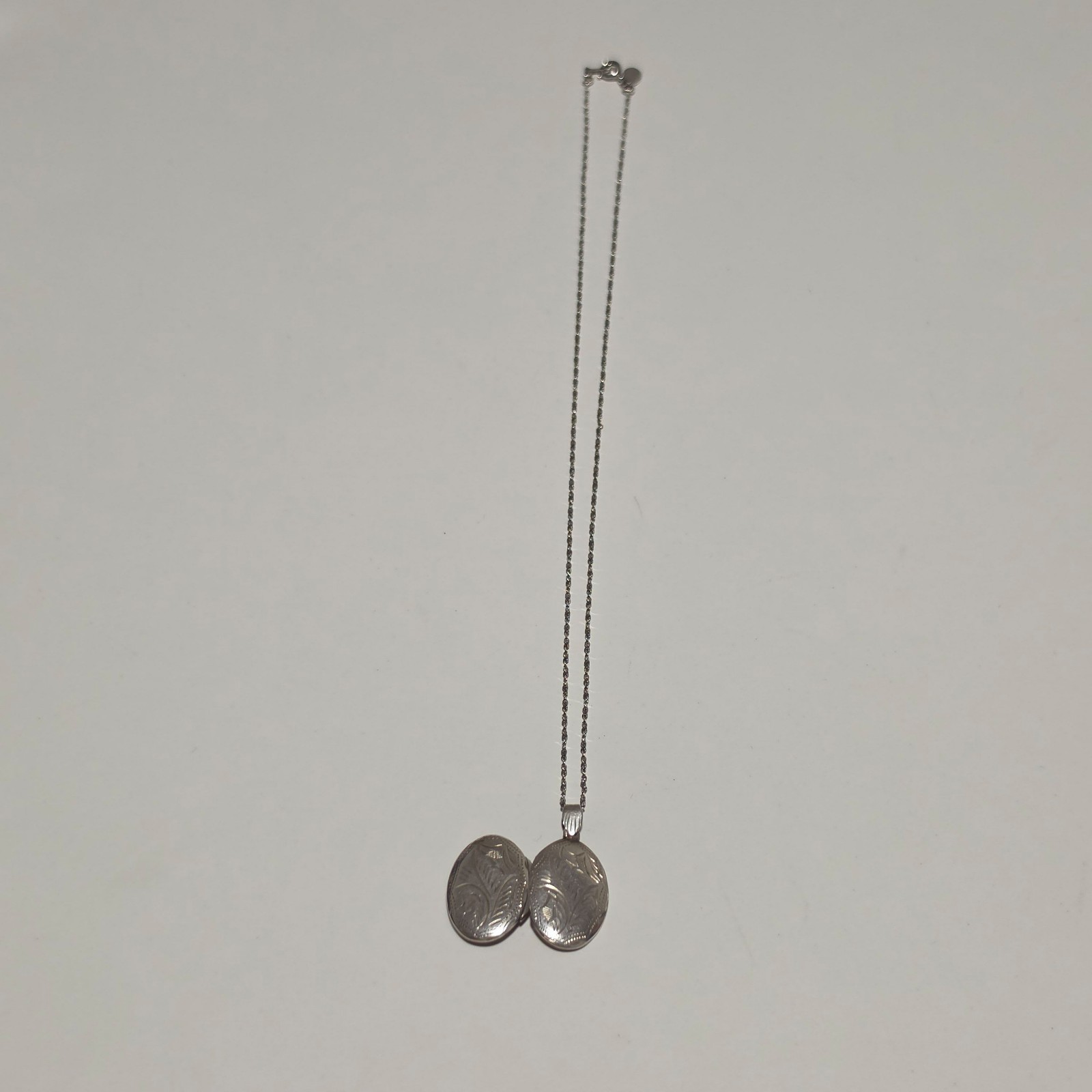 Silver 925 Floral Engraved Oval Locket with emma page chain .b4