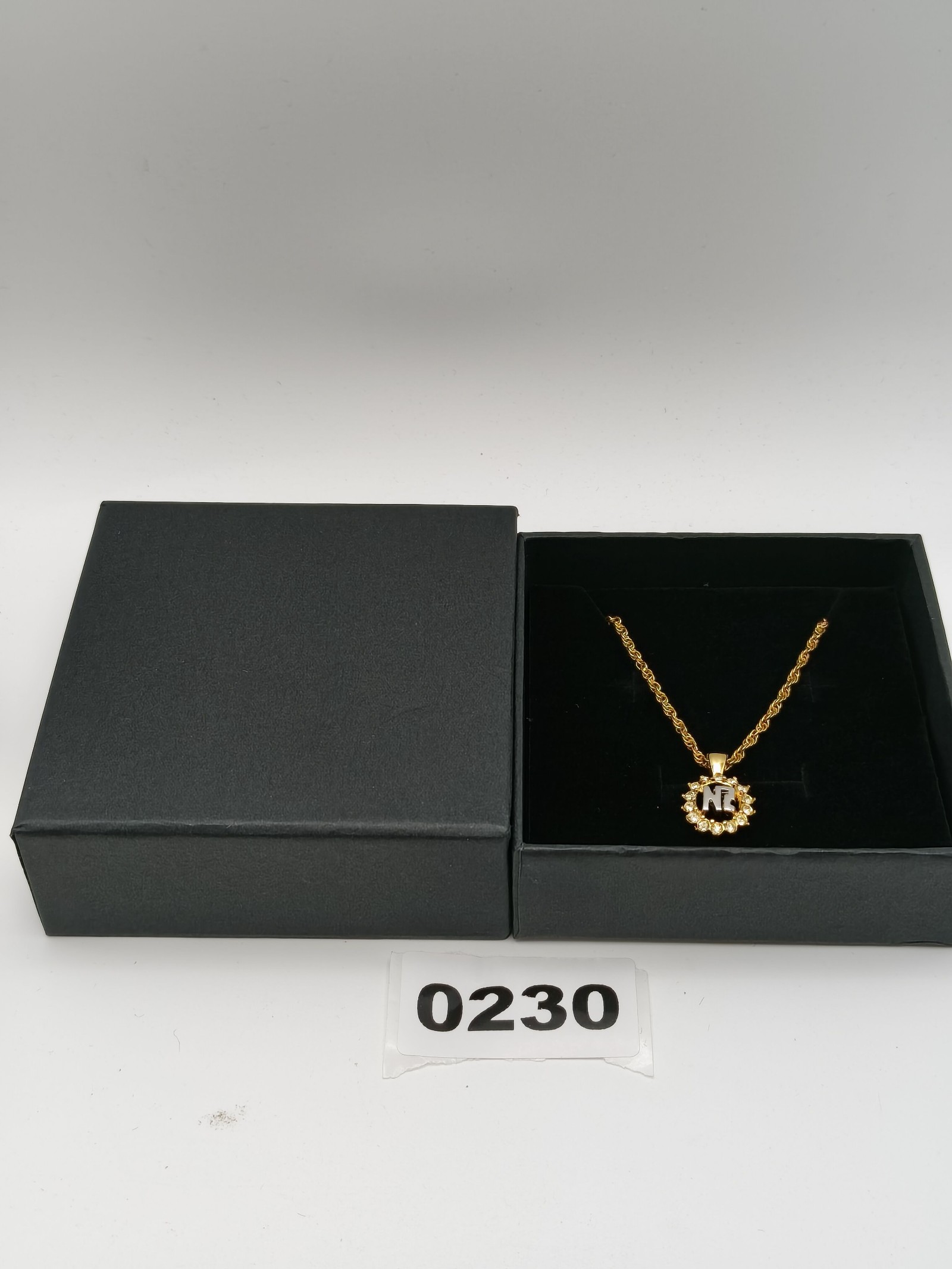 Nina Ricci Gold Tone Necklace with NR Pendant and Clear Stones Other