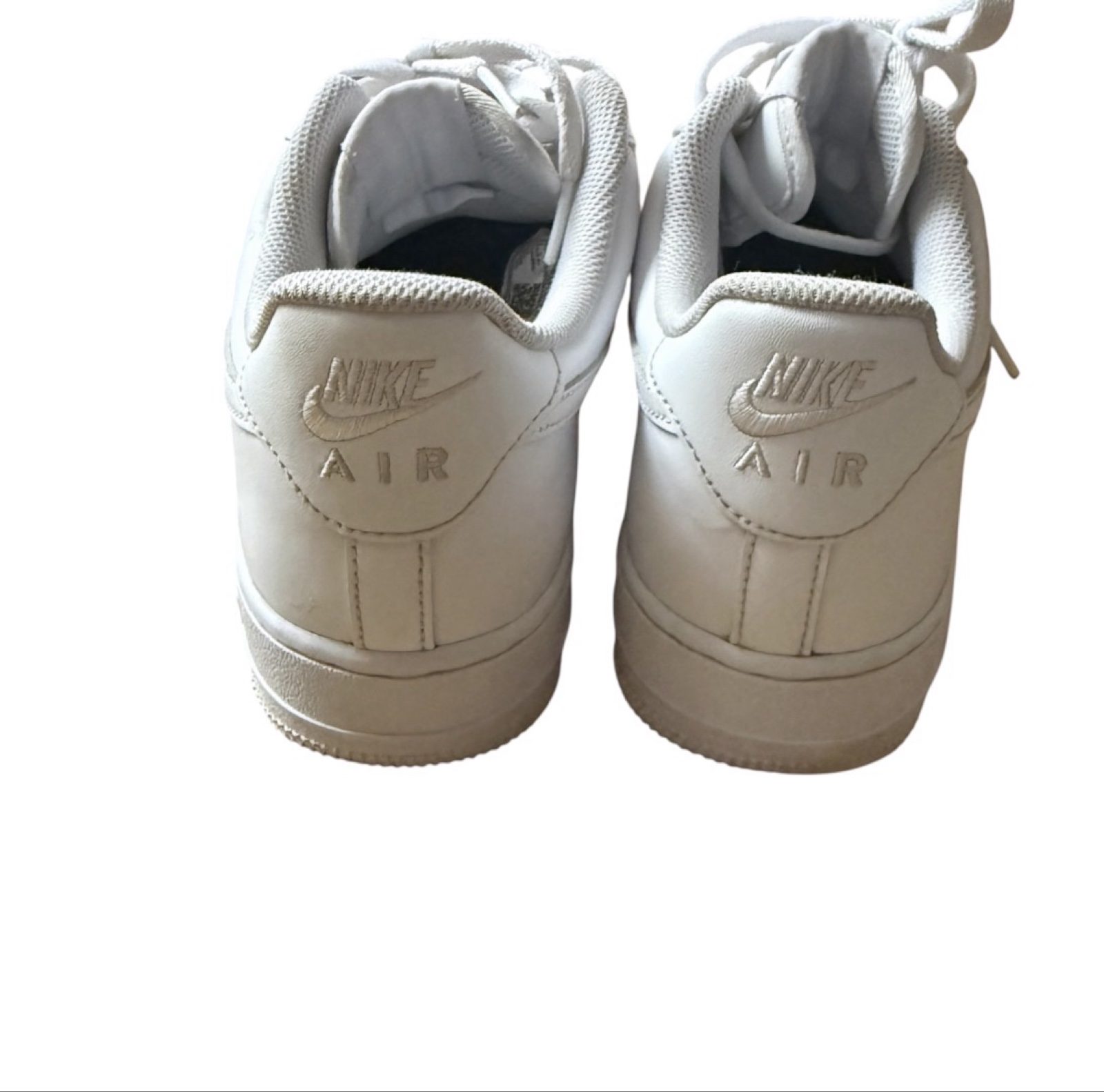Nike Air Force 1 ‘07 men’s white trainers, style CW2288-111. Details: • Brand: Nike • Style: Low-top, lace-up • Colour: White • Labelled size: UK 8.5 / EU 43 / US 9.5 / CM 27.5 • Materials: Leather upper; textile lining; rubber outsole. • Features: Swoosh logos, perforated toe and padded collar. • Condition: Used, with creasing, scuffs and discolouration. IMPORTANT: Two holes in the inner heel lining of EACH shoe, with frayed fabric and the underlying layer exposed. Please review the close-up damage photos before buying. White appears warmer in some photos due to lighting. Fast UK dispatch. Offers welcome. Please check the photos, labelled size and measurements carefully before purchasing. image 4