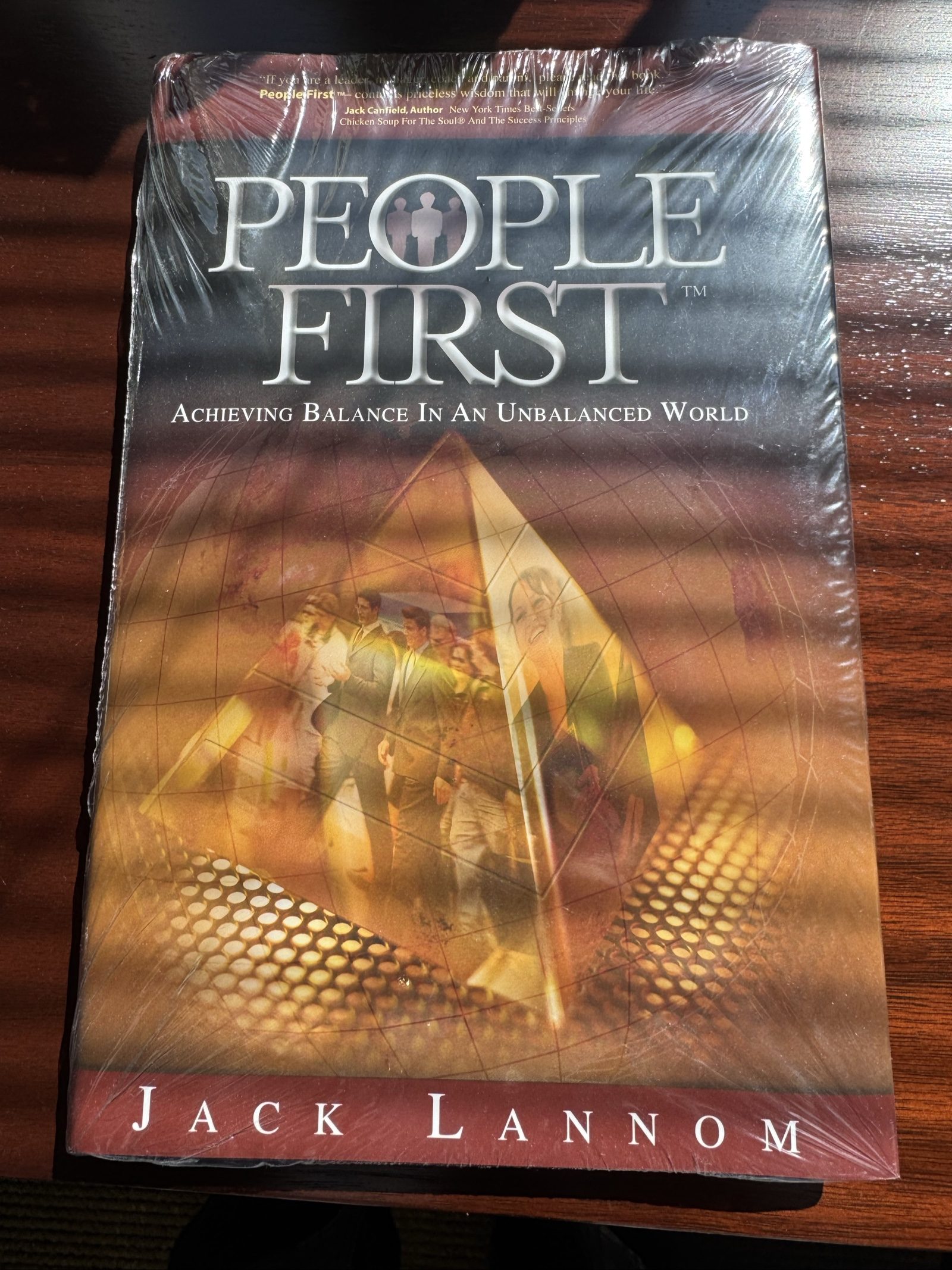 People First: Achieving Balance in an Unbalanced World by Jack Lannom – Hardcover – Sealed