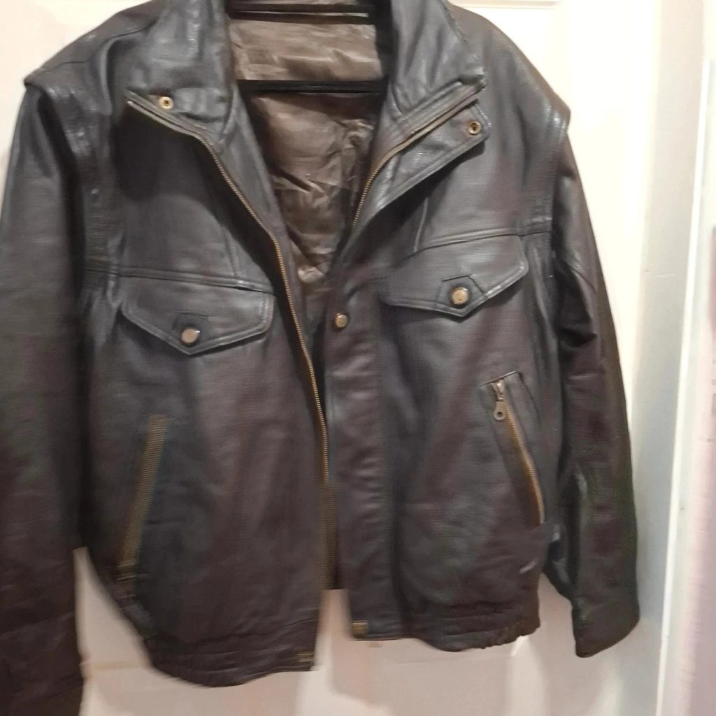 Dark brown leather jacket with graphic on the back