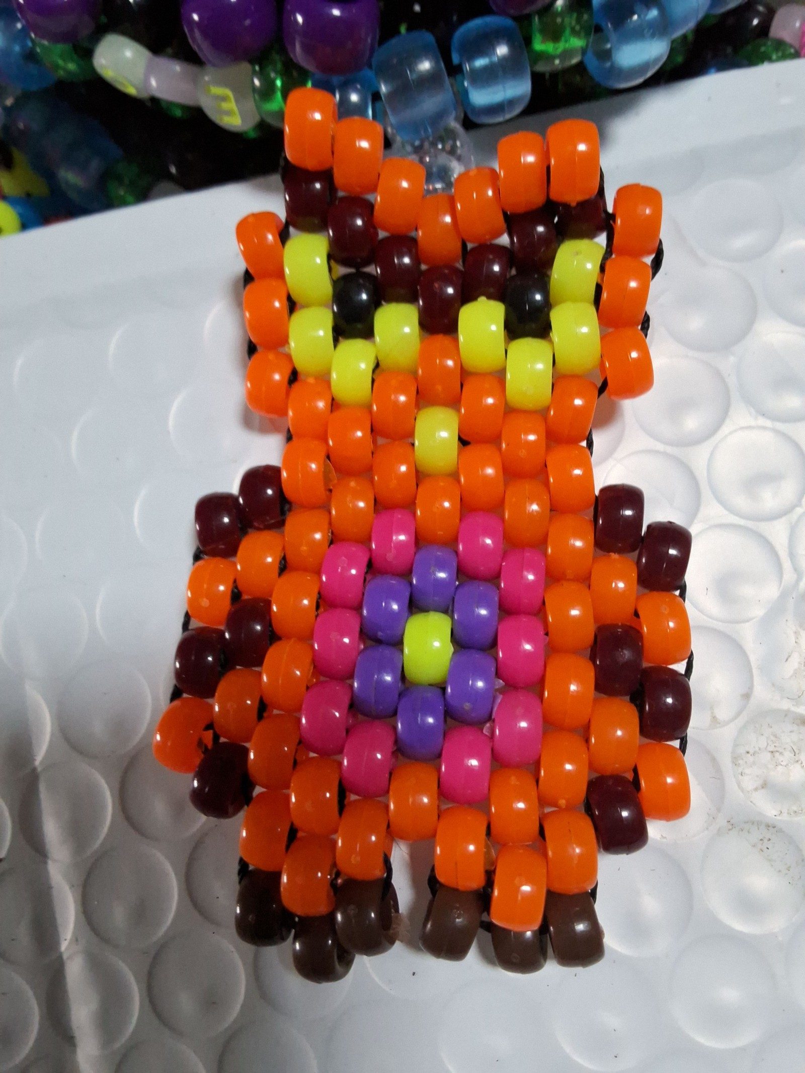 Single Kandi Bracelet with an Orange EDC Owl Attached