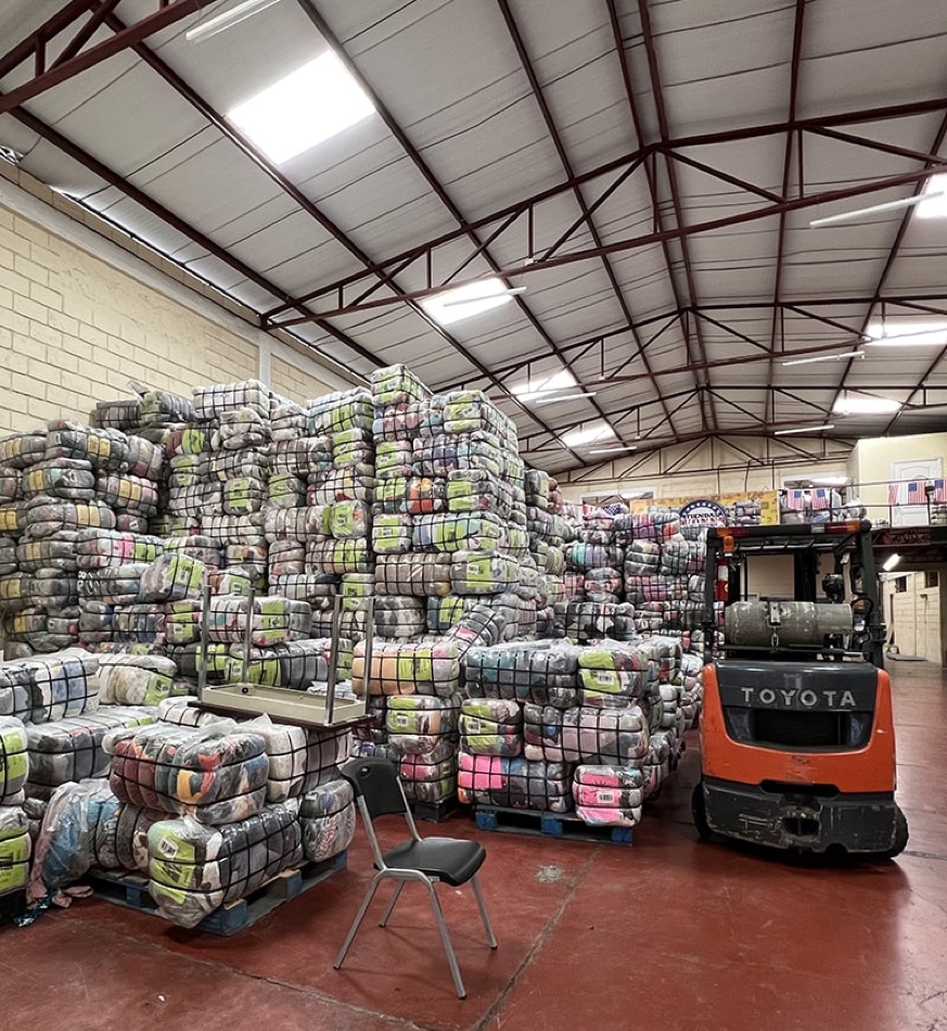 Warehouse with Bales of Clothing - Wholesale casual from Bank & Vogue, 